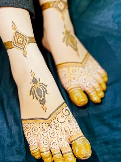 A modern and stylish foot design with geometric elements and a single lotus motif. The ankle band adds a jewelry-like feel.