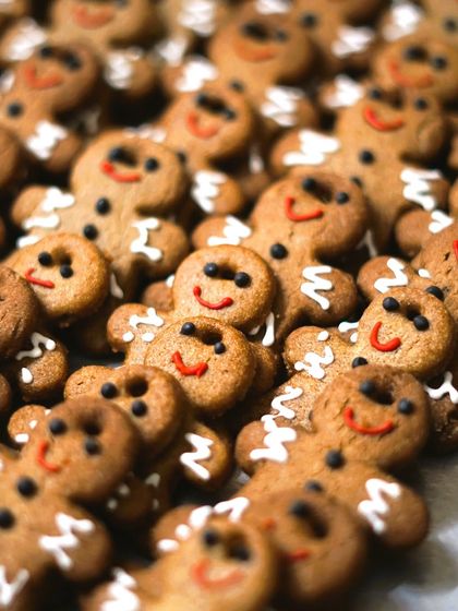 An army of our adorable gingerbread men cookies, fresh from the oven. These classic Christmas treats are spiced to perfection and decorated with a smile, ready to spread holiday cheer.