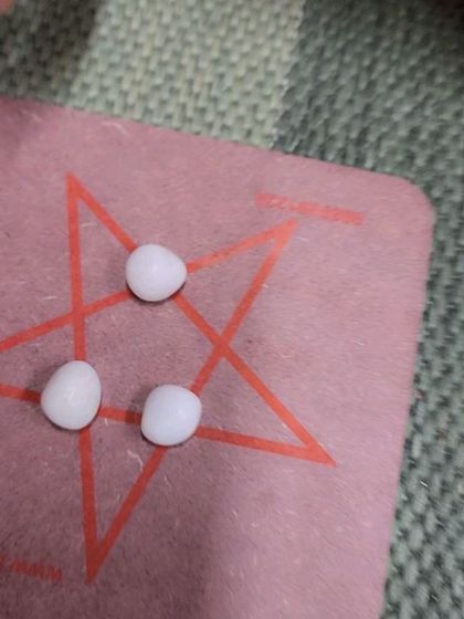 A close-up of another strategic board game played with pebbles. We believe in reviving these traditional Indian games to bring families together for screen-free fun.