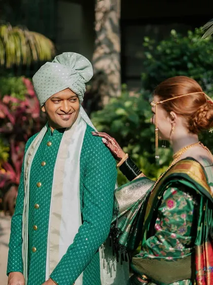 This was such a special moment, blending two cultures in one beautiful look. For her Marathi wedding ceremony, Rach, my lovely bride with Irish roots, embraced tradition in a stunning pure gold Paithani Nauvari saree. We even incorporated a Celtic knot design from her grandmother's scarf into her blouse, a small touch to honor her heritage.
