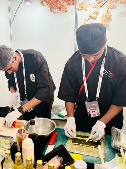 Our chefs in action at an outdoor event. We can set up live sushi-making stations, providing an engaging and delicious experience for your guests.