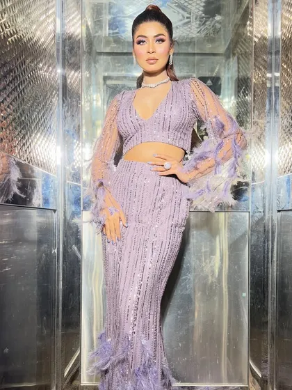 A chic and colorful look for a cocktail party. The lavender outfit is complemented by a pop of color on the eyes.