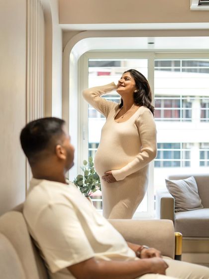 A candid moment during an in-home session. I love capturing the parents-to-be interacting naturally. Here, he's admiring his beautiful partner as she soaks in the sunlight from the window.