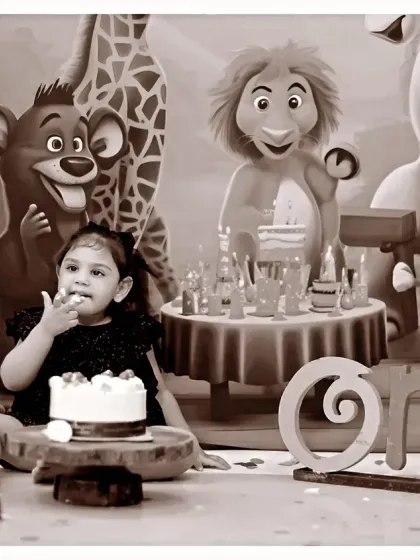 A sepia-toned version of our jungle-themed cake smash, adding a timeless and artistic feel to the birthday celebration photos.