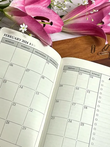 A look inside the monthly spread of our 2024 planner. The layout is clean and spacious, giving you a clear view of your commitments.