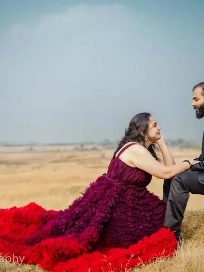 An intimate moment from a pre-wedding shoot. The rich colors of the ombre gown add warmth and romance to this beautiful couple's portrait.