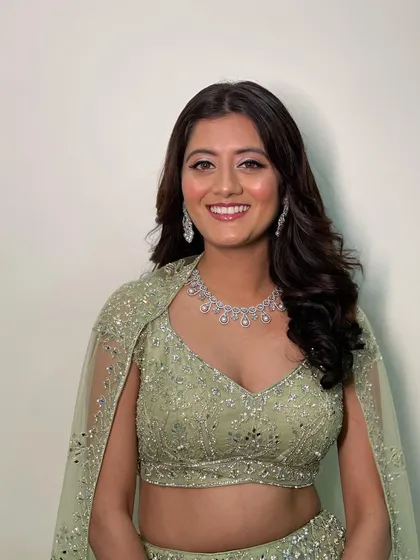 An unfiltered shot of this gorgeous engagement look. The soft, open waves and natural makeup let the client's happiness shine through.