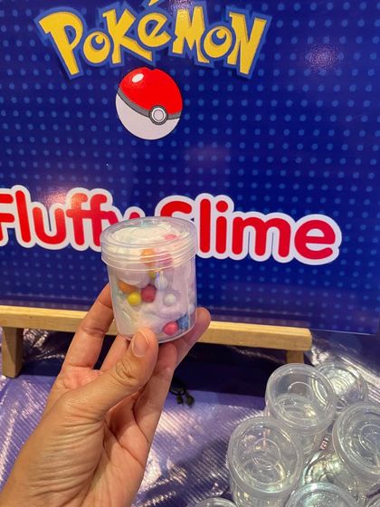 A finished pot of Pokémon-themed fluffy slime, ready to be taken home as a party favor. I provide all the ingredients for kids to mix their own.