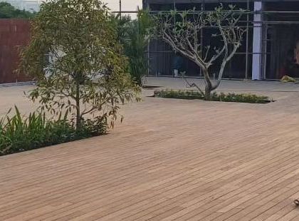 Another angle of the large-scale decking project, showing how the wooden surface seamlessly integrates with the surrounding landscape.