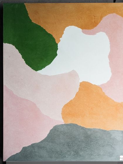 This custom-made multicolor concrete slab is a piece of art in itself. The abstract, layered colors create a landscape-like effect, perfect for a statement dining table or countertop.