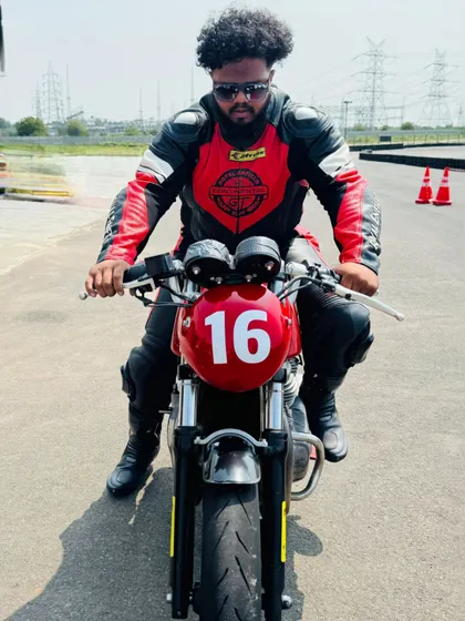 "Run the race of life at your own pace." A rider embodying this philosophy on the track.