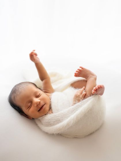 A happy, sleepy stretch! I love capturing these little movements that show off their personality even while they're dreaming.