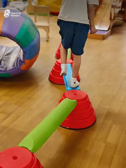 Occupational therapy can look like play, because that’s when children learn best. Here, a child navigates an obstacle course, building balance, coordination, and body awareness, which are foundational skills for focus and self-regulation in daily life.