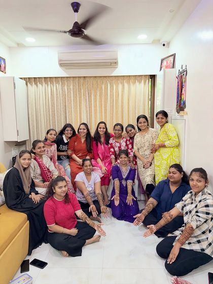 Our entire batch of talented students, proudly showing the beautiful mehndi designs they created for their final exam. The room was filled with creativity and positive energy.