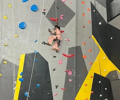 This young climber from our outreach event fearlessly scales the wall. I believe in providing opportunities for everyone to experience the confidence boost that comes from conquering a climb.