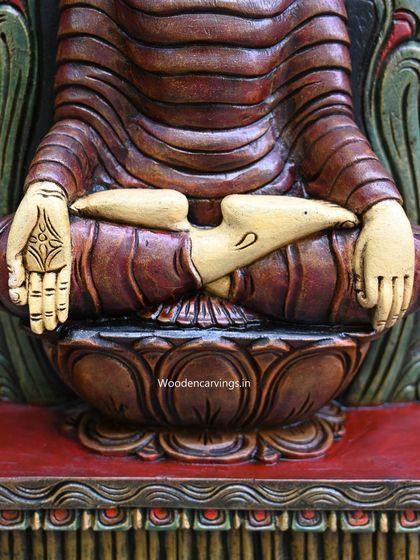A detail of the hands of the 24-inch ancient-look Buddha, resting in the lap in a meditative pose.