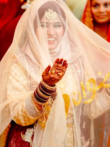 A happy bride showing off her beautiful henna stain on her wedding day. The color is rich and vibrant, just as it should be.