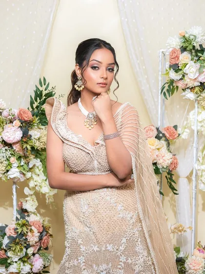 A confident and poised portrait. The bride looks like a modern goddess, with her makeup enhancing her features and giving her an incredible glow.