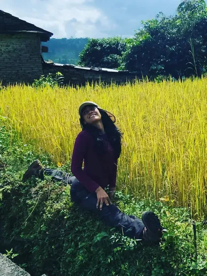 Taking a moment to relax and be present in the lush paddy fields of Nepal. Mindfulness is woven into every part of our retreat experience.