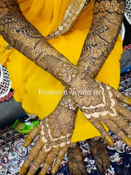 Faiza's mehndi journey, from the fresh paste to the final look. This design features a mix of geometric and floral patterns, with names personalized on the palms.