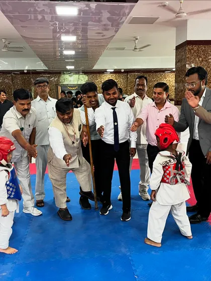 Even the youngest competitors get to experience the thrill of the tournament. Here, two of my smallest students are in the ring, surrounded by encouraging officials and parents.