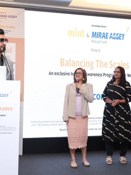 Interacting with attendees on stage at the Mirae Asset summit. I believe in making formal events feel more personal by creating moments of direct engagement.