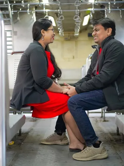 Finding romance in the everyday. This couple shares a laugh while seated in a Mumbai local train, a location that was part of their story. I focus on making you feel comfortable so your real personalities come through.