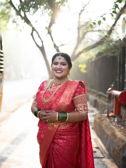 A beautifully lit portrait of the bride, her makeup glowing in the sunlight.
