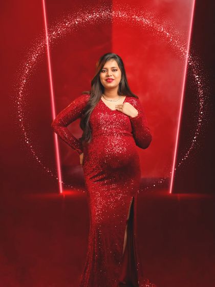 A touch of magic with a sparkling halo effect added to this glamorous red gown portrait.