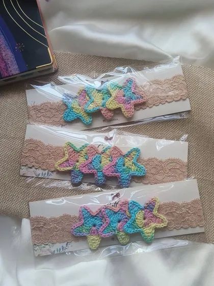 Preparing a batch of our pastel star newborn headbands. They are a popular choice for baby shower gifts and newborn photoshoots.