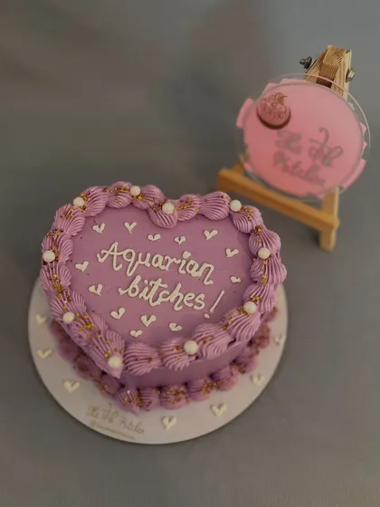 I love creating cakes with a bit of personality. This cheeky heart-shaped bento cake was made for an Aquarian's birthday celebration, showing how you can get really specific with your custom messages.