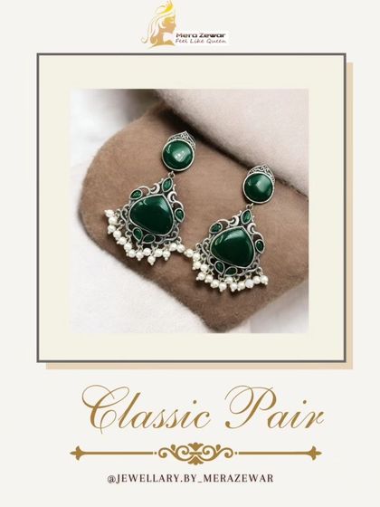 The classic dangle earrings in a rich emerald green. The combination of the green stone, oxidized silver, and pearls is a timeless recipe for elegance.