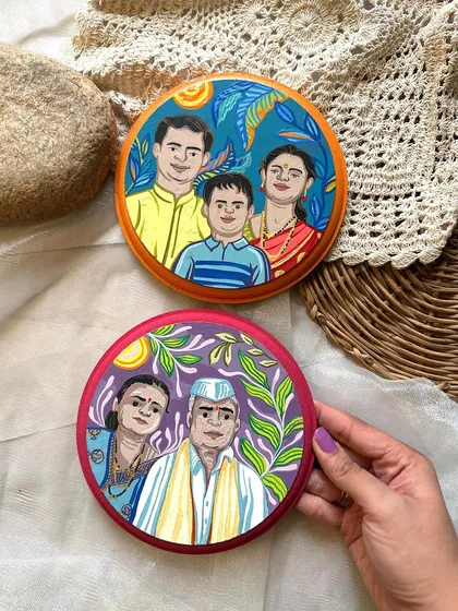 A set of two personalized wall plates, each capturing a different generation. One features a young family, and the other, the grandparents.