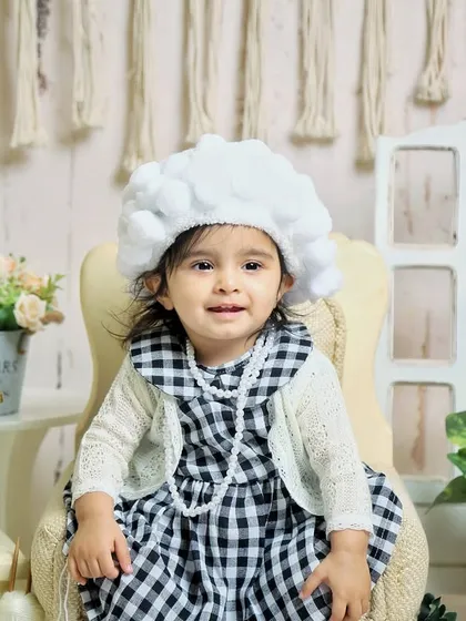 A portrait of our "little old lady" in her chair. Themed shoots are a fantastic way to create a unique and humorous set of photos to remember this age.