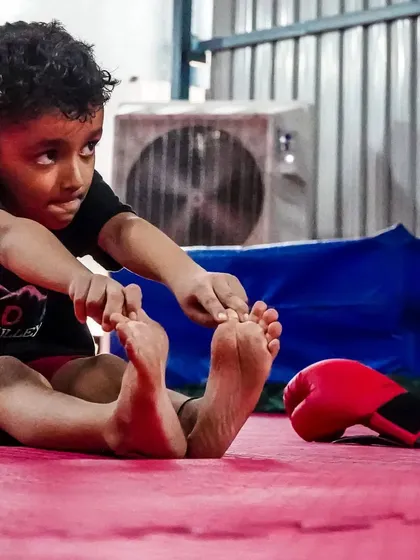 Focus and determination in the eyes of a future champion. Our kids' program is designed to build mental strength and the ability to concentrate on a goal.