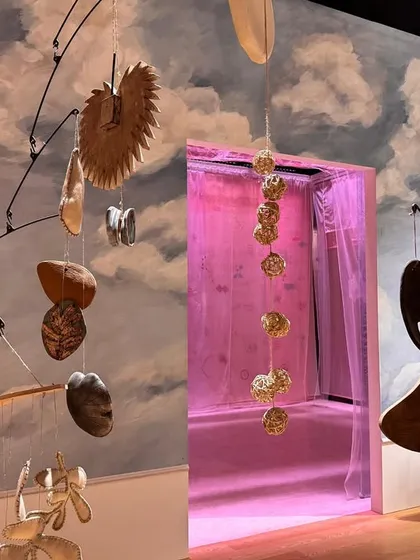 A delicate mobile from the 'Feel More' installation, featuring a collection of small, found, and crafted objects. This piece invites deeper exploration and transforms the experience into a meditative journey of discovery.