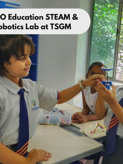 Two students at TSGM proudly display their completed LEGO model. Completing a project from start to finish gives students a great sense of accomplishment and confidence.