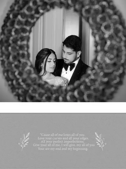 A creative black and white portrait of the couple seen through a decorative mirror, paired with romantic song lyrics.