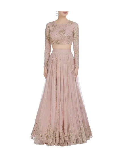 An example of a more modern and elegant reception lehenga. This piece features a full-sleeve embroidered blouse and a lightweight, pleated skirt, offering a sophisticated look without heavy embellishments for events like sangeets or cocktail parties.