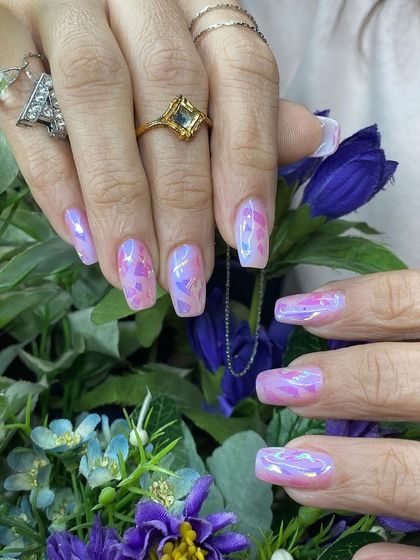 Stunning "glass" or "aurora" nails with iridescent shards that catch the light beautifully. This is a very popular Korean trend.