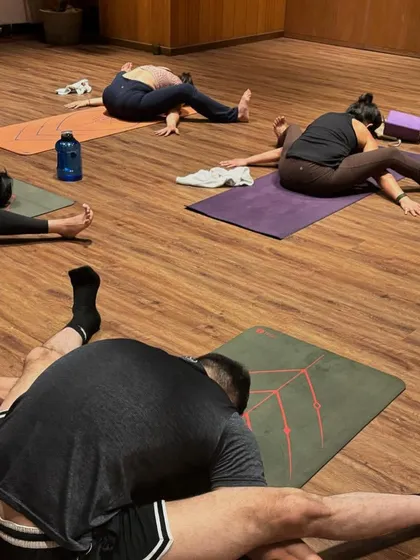Students in a reclining twist, a gentle way to release the spine and calm the nervous system at the end of a practice.