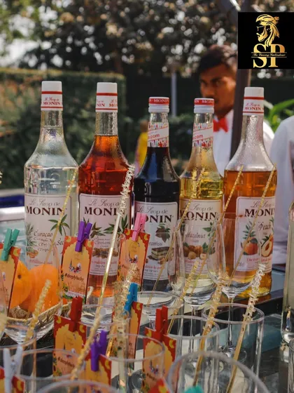 A lineup of Monin syrups ready for action. We use high-quality ingredients and offer a wide variety of flavors to create custom cocktails for your guests.