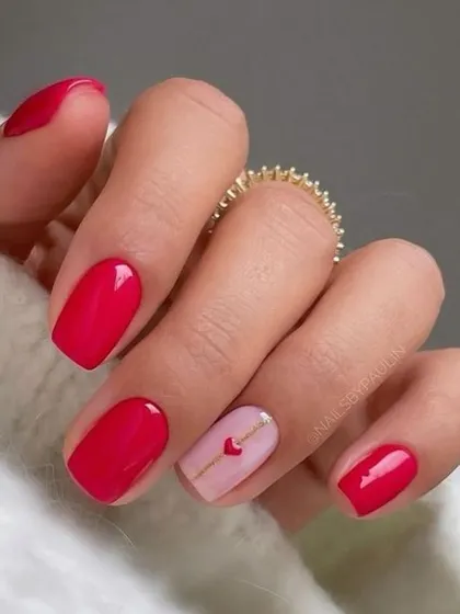 A simple and sweet Valentine's design. A single accent nail with a love letter heart complements the classic, glossy red of the other nails.