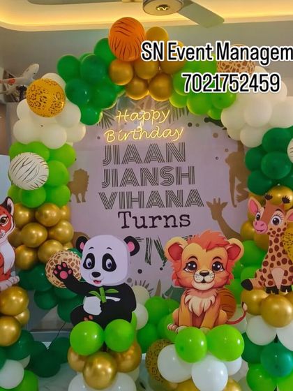 A cute and simple jungle theme with baby animal cutouts. The green and gold balloon arch is perfect for a home celebration, bringing a touch of the wild indoors.