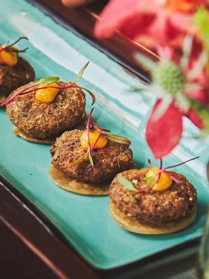 A vegetarian take on the classic shaami kebab. I use Rajasthani Ker and Sangri to create these succulent kebabs, served on tiny bajra rotlas with an achari aioli.