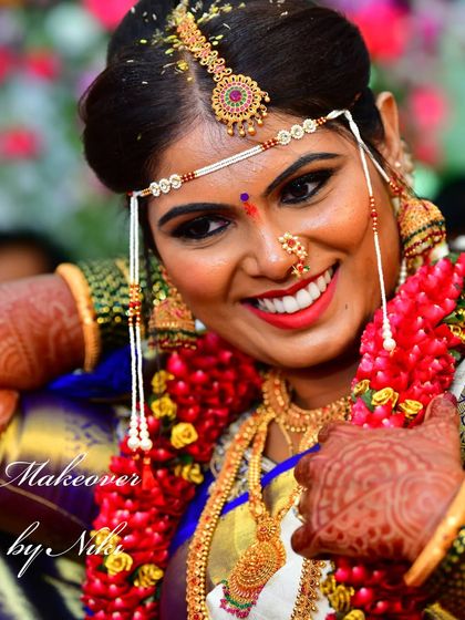 The joy of a bride on her wedding day. This candid shot captures the happiness and radiance of the moment, with makeup designed to look beautiful from every angle.
