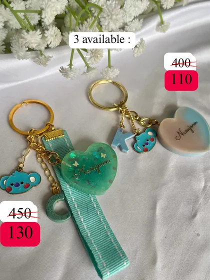 For the Namjoon stans. These keychains are inspired by our thoughtful leader, complete with Koya charms. Only a few are available.