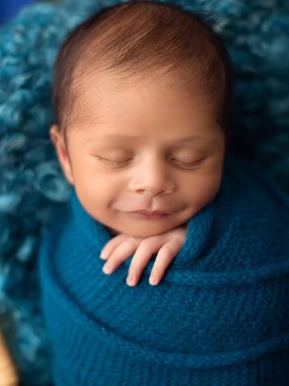 That little smirk is just priceless. It's amazing to see their little personalities shining through, even as they sleep.