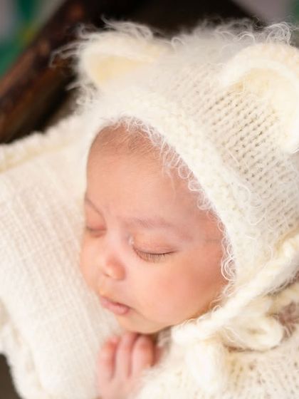 A detailed shot of the teddy bear bonnet. The soft texture and cute ears make this one of my most requested props for baby boys.