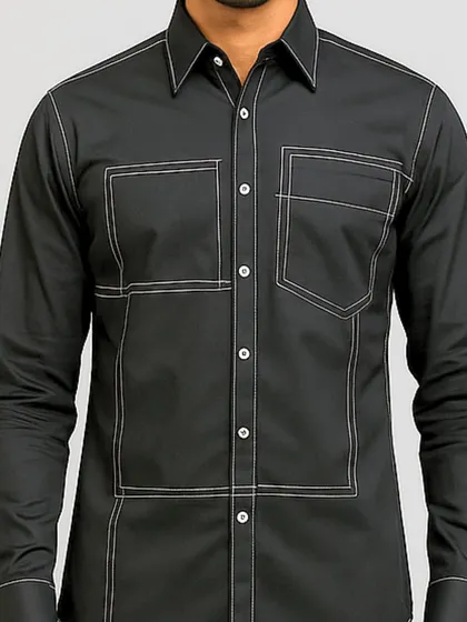 A close-up of the torso, focusing on the geometric stitching and the dual chest pockets. The precision of the lines gives the shirt a clean, architectural feel.